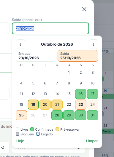 Calendário do campo Saída, com as abas Entrada e Saída e os dias ocupados nas cores de cada status
